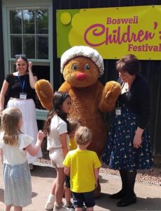 Picture of cuddly Haggis figure meeting children