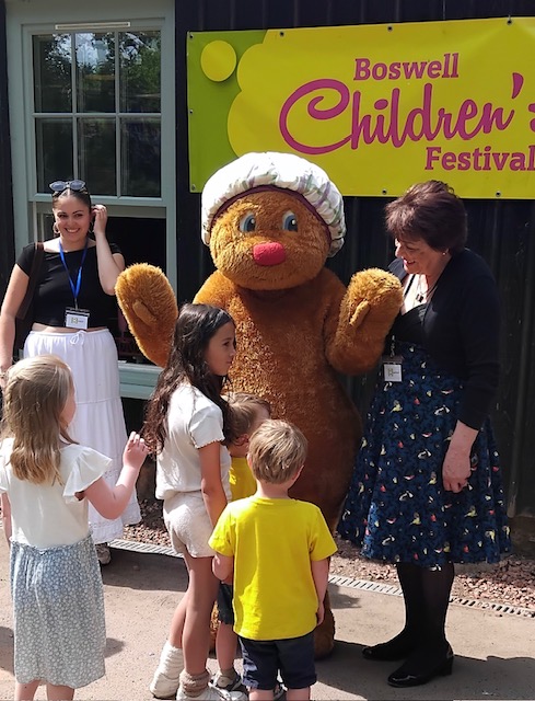 Picture of cuddly Haggis figure meeting children